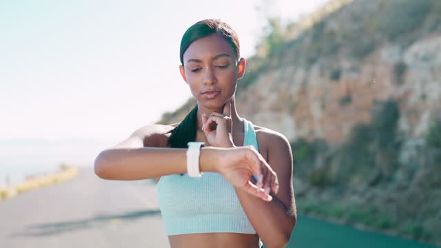 Fitness, heartbeat and woman in road with smart watch for heart rate, progress and timing during training run. Cardio, pulse and indian girl with tracking app for time, steps and workout monitor