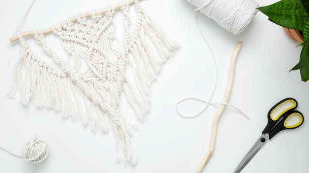 istock Creative hobby handmade macrame for home decoration. Weaving macrame at home. Tools and materials for macrame weaving. Flat lay, top view 1485451123