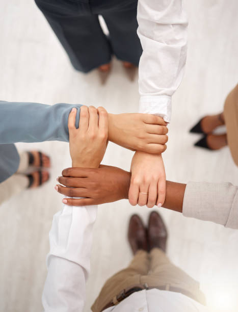 istock Support, business team and holding hands for work community, office and teamwork. Team building, diversity and group collaboration above of corporate employees with solidarity and hope together 1485451625