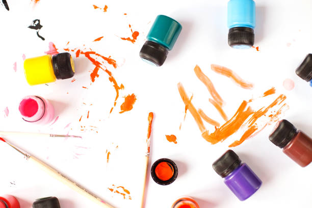 istock multicolored acrylic paints on a table with brushes. DIY 1485451975