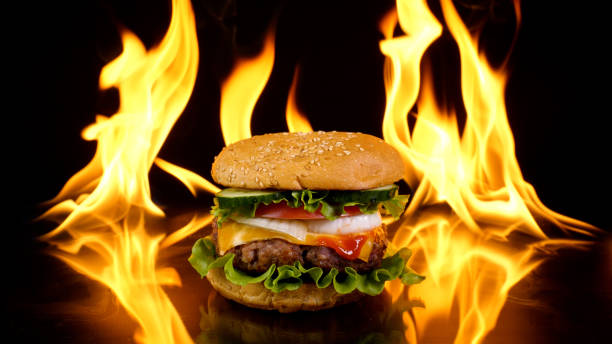istock Delicious burger on the background of fire 1485453785