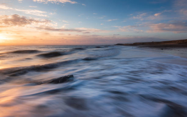 istock Soft sunrise glow at Happisburgh beach, Norfolk 1485454508