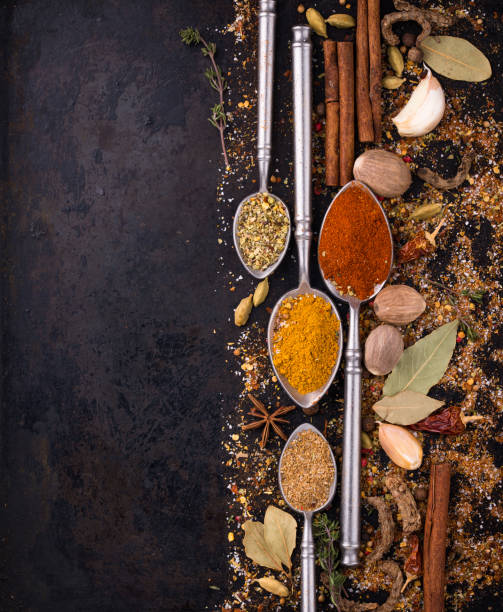 istock Different spices and herbs on a black background 1485455310