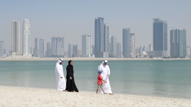 Multi-generation Emirati family on the beach