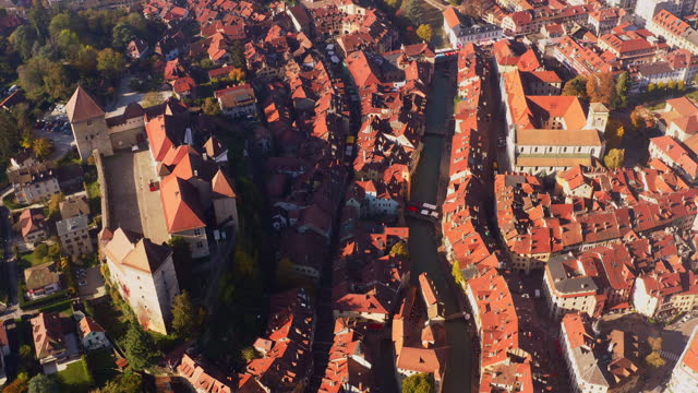 4k uhd drone aerial view of France travel and landmarks. Romantic beautiful old town of famous destination Annecy town with medieval architecture building sunset
