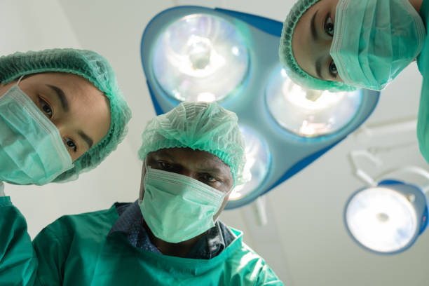 istock Medical urgency in the ambulance. Emergency doctor using defibrillator, ICU, AED, electro pulse therapy, emergency room, resuscitation, cardiac arrest, danger, heart, surgeon, cardiology, patient 1485456512