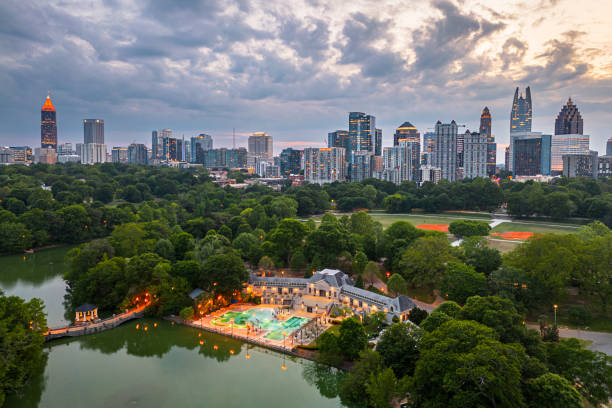 Atlanta, Georgia, USA Over Piedmont Park Atlanta, Georgia, USA overlooking Piedmont Park at dusk. atlanta skyline stock pictures, royalty-free photos & images