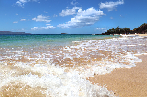 Gold Sand Beach with wave Crashing.  Maui, Hawaii.  Sunny Blue Sky