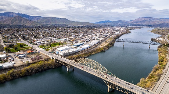 An aerial view of the Wenatchee Valley and nearby bright blue Columbia River on a bright day