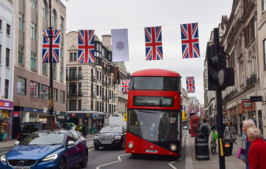 London, UK - April 26 2023:  The Strand lined with Union Jack flags ahead of the coronation of King Charles III.