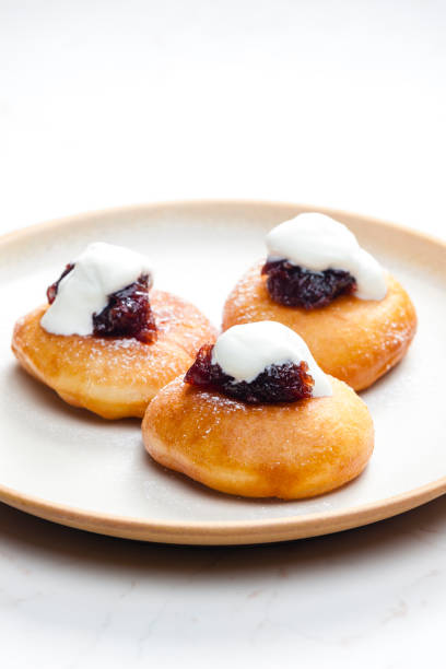 istock fried muffins with plum jam and sour cream 1485469198