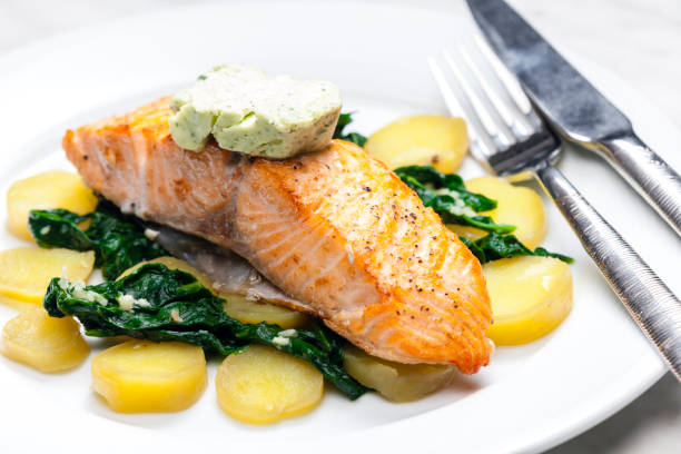 istock baked salmon with spinach leaves and potatoes 1485469901