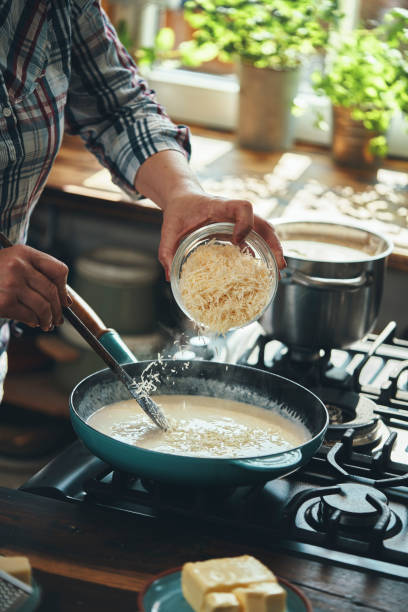 istock Preparing Fettuccine Pasta Alfredo with Parmesan 1485472476