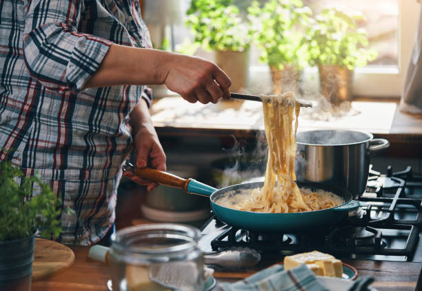 istock Preparing Fettuccine Pasta Alfredo with Parmesan 1485472479