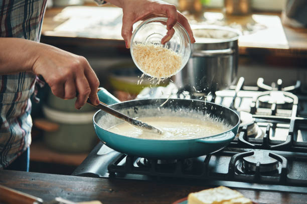 istock Preparing Fettuccine Pasta Alfredo with Parmesan 1485472518