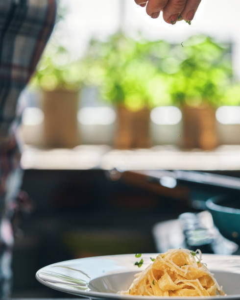 istock Preparing Fettuccine Pasta Alfredo with Parmesan 1485472647
