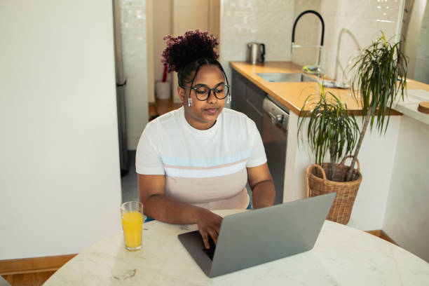 istock Woman is using a laptop at home 1485472668