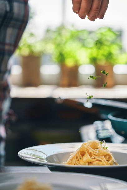 istock Preparing Fettuccine Pasta Alfredo with Parmesan 1485472686