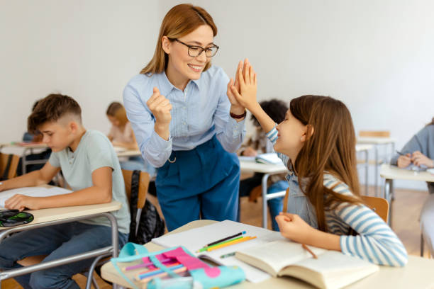 Becoming a top student with the help of her teacher stock photo
