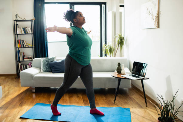 istock Happy young woman exercising 1485478249