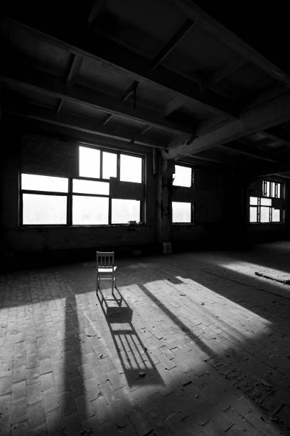 Black and white photo of abandoned building interior.