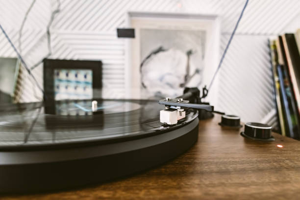 istock Vinyl record player, bright lights disco-bokeh. Needle on vinyl record. 1485481500