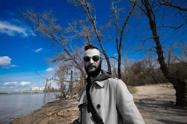 young handsome bearded hipster man in the city.