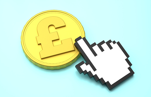 Cursor hand clicks the gold Pound Symbol coin. Finance Concept.