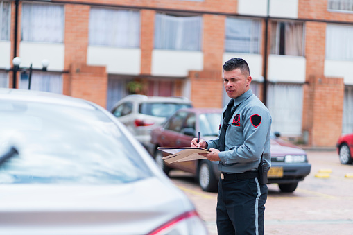 Police officers issuing a traffic fine to a road offender in Maboneng, Johannesburg.  Maboneng meaning 'a place of light' is a precinct of Johannesburg city and regeneration development in the city centre attracting new business, arts and culture.