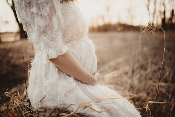 istock Pregnant woman sitting outdoors with copy space 1485485891