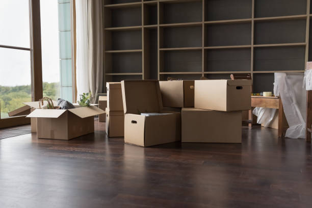istock Heap of paper boxes for moving stacked on floor 1485486043
