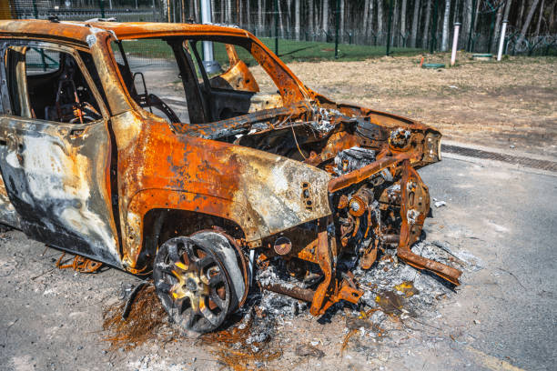 Burnt car on the side of the road