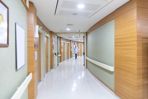 istock Blurred people walking in hospital corridor 1485491717