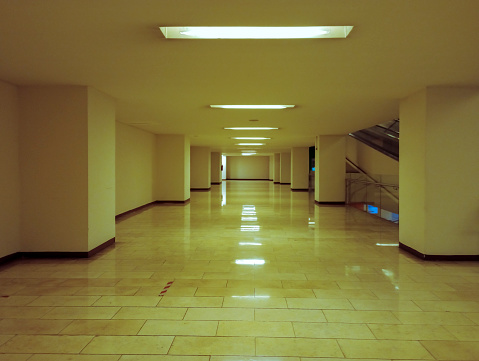 Interior corridor in Latin American city, desolate urban space with artificial lighting y natural in latin america.