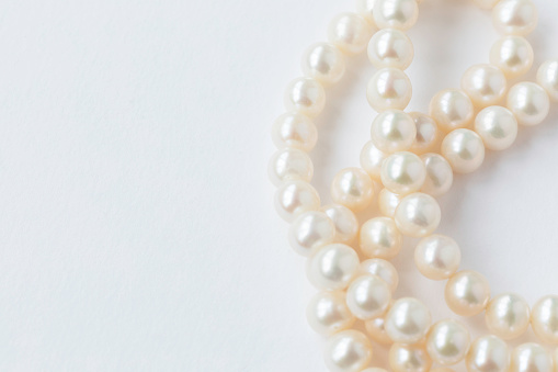 White pearls on white background.