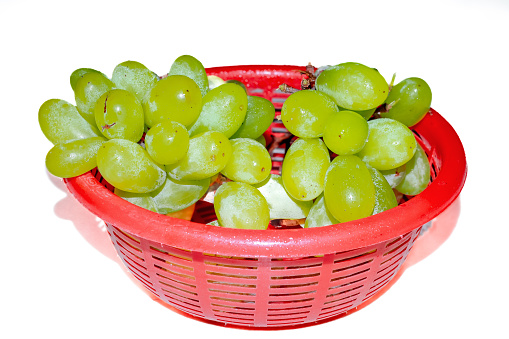 Green grape with the basket isolated on white. With clipping path. Full depth of field.
