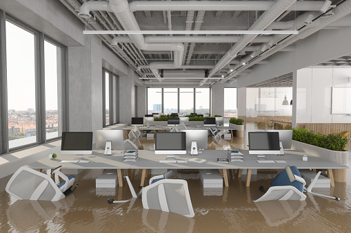 Flooded Office With Chairs Floating On Water. 3D Rendering