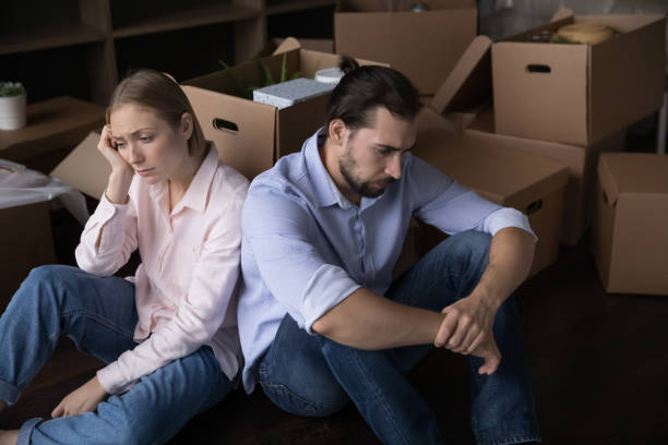 istock Upset unhappy young couple moving out from home 1485496493