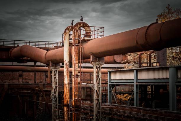 istock Abandoned building with multiple rusty pipes. Old factory in Germany. 1485496960