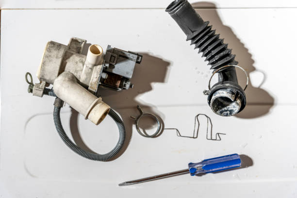 istock broken old washing machine water pump and rubber hoses 1485497569