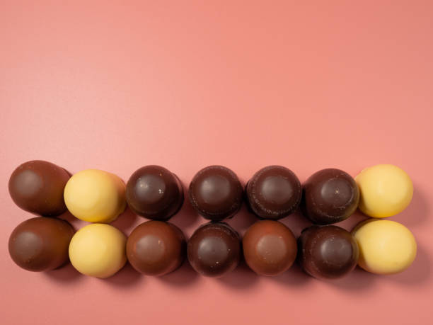 istock Chocolate covered marshmallow on a pink background. 1485502281