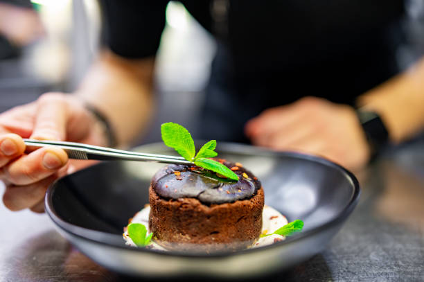 istock chef decorated Basque cheesecake with Chocolate and cream in bowl on kitchen 1485505898