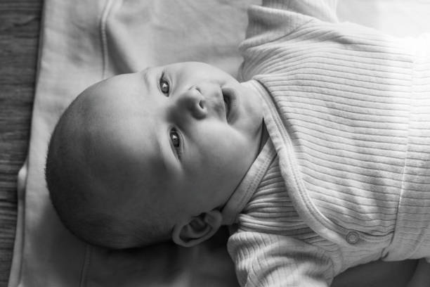 portrait of a little boy close-up, monochrome photo - baby human eye blue toned image imagens e fotografias de stock