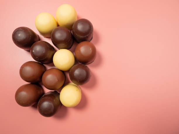 istock Chocolate covered marshmallow on a pink background. 1485509420
