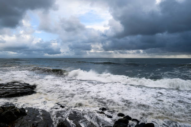 Early morning ocean waves and clouds as a storm passes through the area.