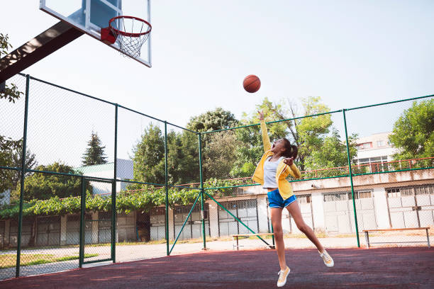istock Teenage girl practicing basketball 1485510140