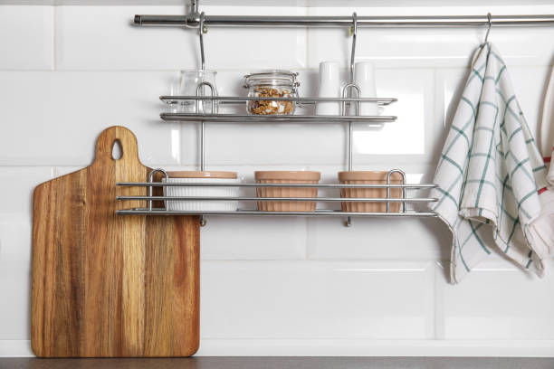 istock Kitchen towel hanging on hook rod and shelves with ramekins indoors 1485512156
