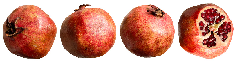 ripe pomegranate in different poses on a white background