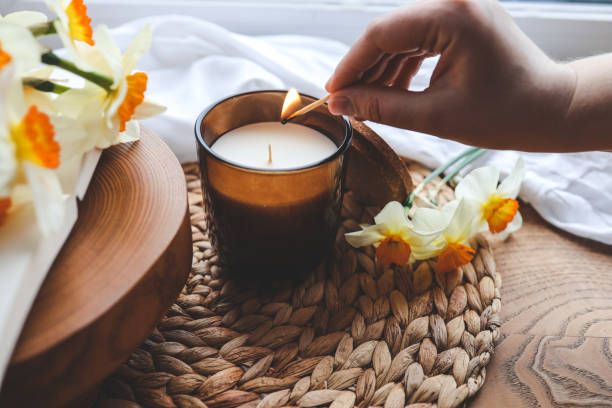 istock Match in hand lights a candle, atmospheric photo 1485518149