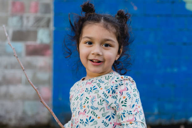 istock Adorable Little Girl Playing in Backyard 1485518605